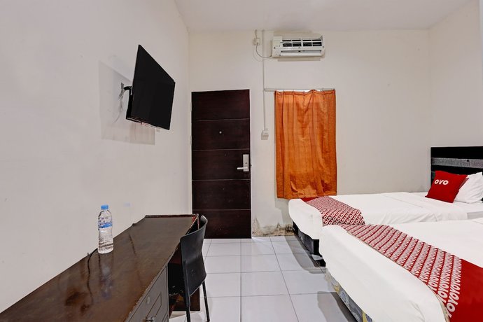 Imagen de la habitación del Hotel OYO 91861 Pemuda Kemuning Guest House. Foto 16