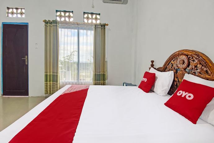 Imagen de la habitación del Hotel OYO 91927 Homestay Kebun. Foto 7