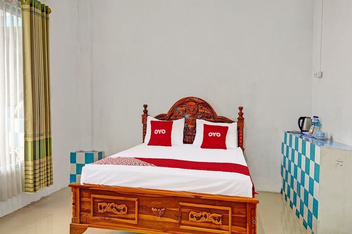 Imagen de la habitación del Hotel OYO 91927 Homestay Kebun. Foto 9
