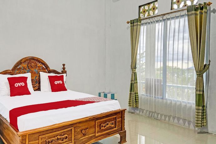 Imagen de la habitación del Hotel OYO 91927 Homestay Kebun. Foto 11