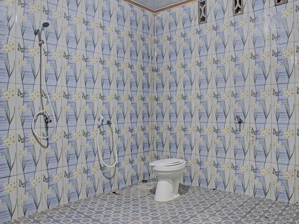 Imagen de la habitación del Hotel OYO 91927 Homestay Kebun. Foto 12