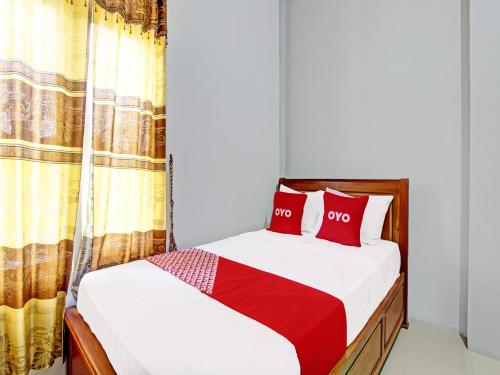 Imagen de la habitación del Hotel OYO 91960 Fariza House Syariah. Foto 19