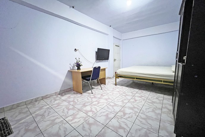 Imagen de la habitación del Hotel OYO 92002 Wisma Samudra. Foto 9
