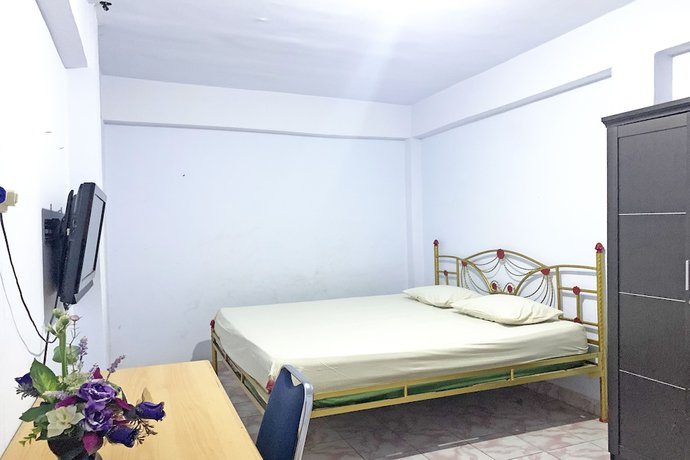 Imagen de la habitación del Hotel OYO 92002 Wisma Samudra. Foto 11