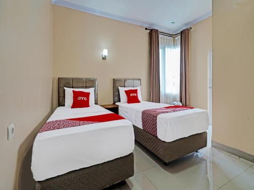 Imagen de la habitación del Hotel OYO 92023 Singgasana Cipelah Syariah. Foto 18