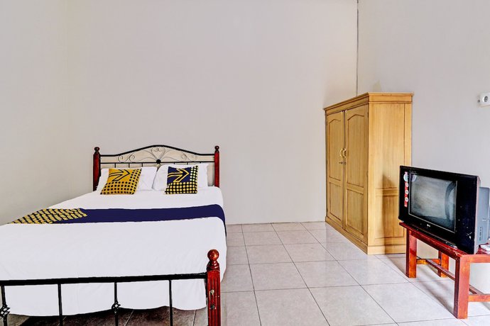 Imagen de la habitación del Hotel OYO 92056 Asri Kost Syariah. Foto 2