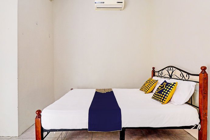 Imagen de la habitación del Hotel OYO 92056 Asri Kost Syariah. Foto 4