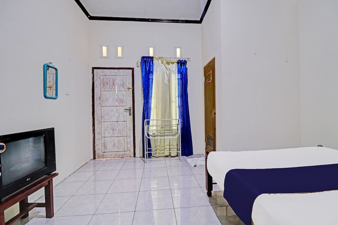 Imagen de la habitación del Hotel OYO 92056 Asri Kost Syariah. Foto 5