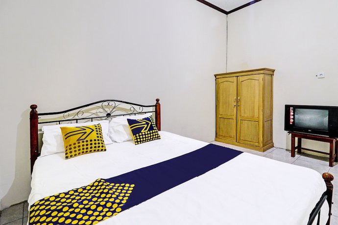 Imagen de la habitación del Hotel OYO 92056 Asri Kost Syariah. Foto 6