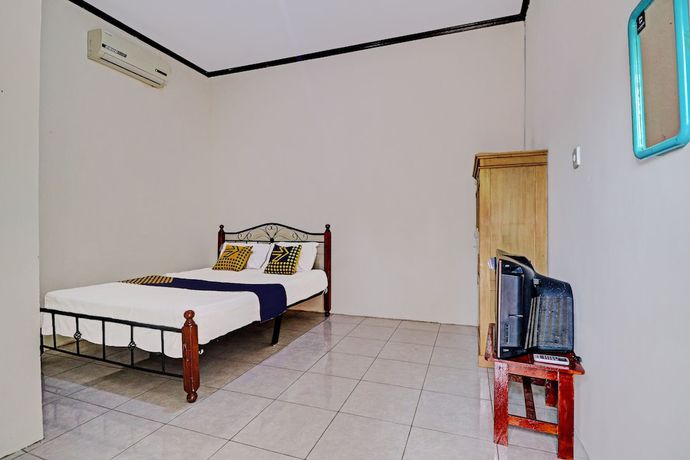 Imagen de la habitación del Hotel OYO 92056 Asri Kost Syariah. Foto 7