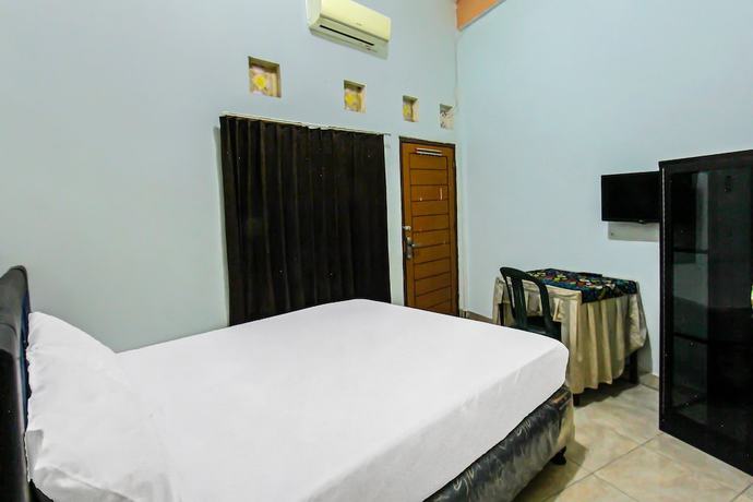 Imagen de la habitación del Hotel OYO 92095 Wisma Dhana Syariah. Foto 3