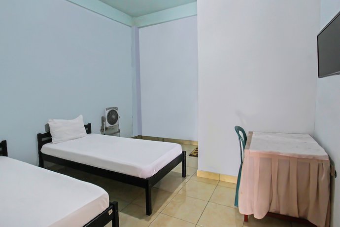 Imagen de la habitación del Hotel OYO 92095 Wisma Dhana Syariah. Foto 4