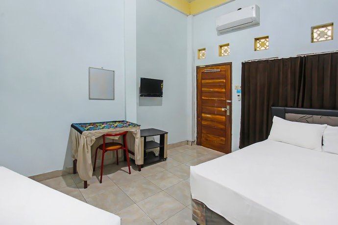 Imagen de la habitación del Hotel OYO 92095 Wisma Dhana Syariah. Foto 5