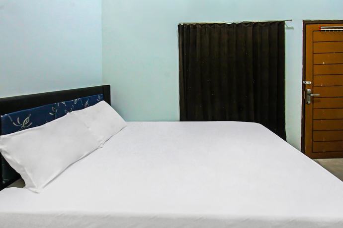 Imagen de la habitación del Hotel OYO 92095 Wisma Dhana Syariah. Foto 6