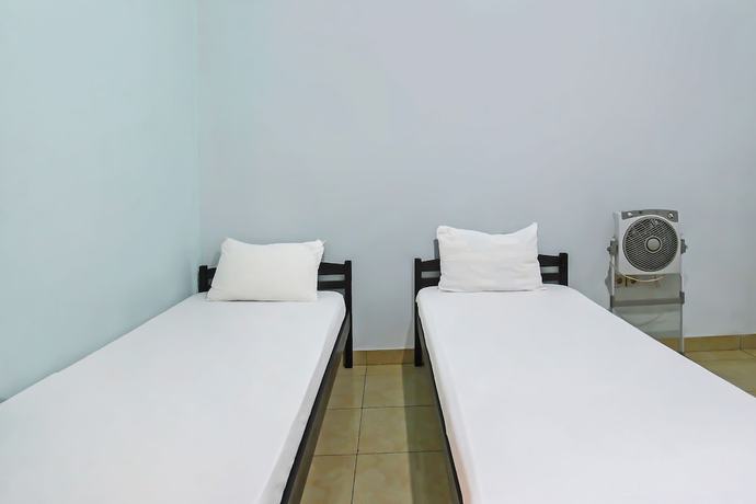 Imagen de la habitación del Hotel OYO 92095 Wisma Dhana Syariah. Foto 7