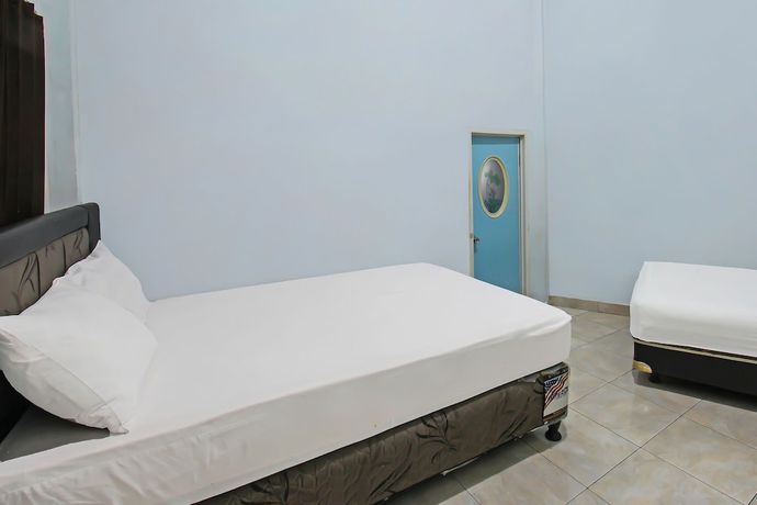 Imagen de la habitación del Hotel OYO 92095 Wisma Dhana Syariah. Foto 8