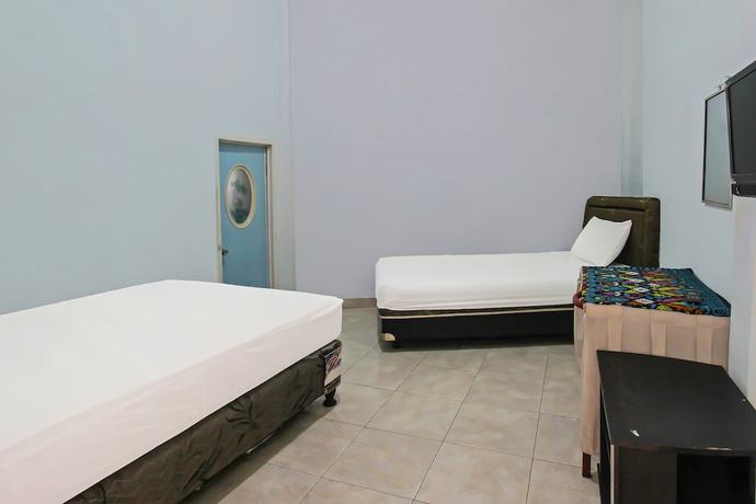 Imagen de la habitación del Hotel OYO 92095 Wisma Dhana Syariah. Foto 9