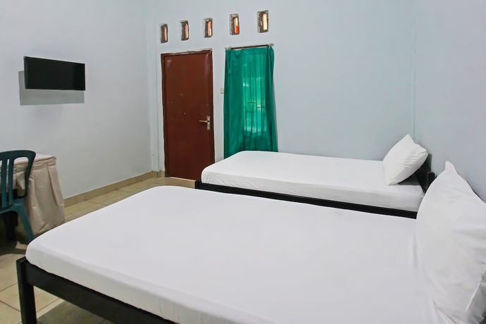 Imagen de la habitación del Hotel OYO 92095 Wisma Dhana Syariah. Foto 10