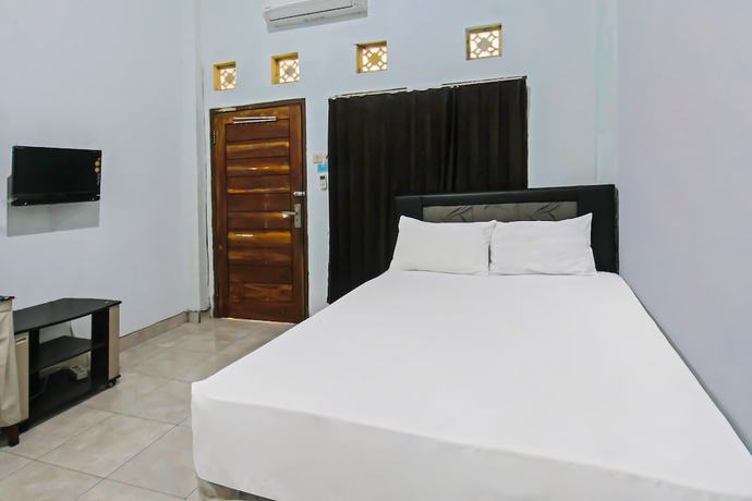 Imagen de la habitación del Hotel OYO 92095 Wisma Dhana Syariah. Foto 12
