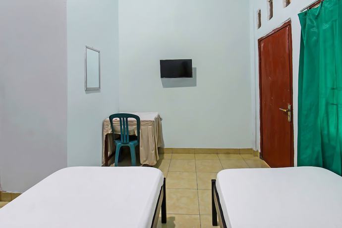 Imagen de la habitación del Hotel OYO 92095 Wisma Dhana Syariah. Foto 13