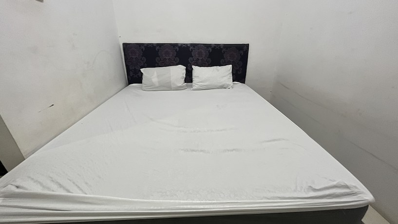 Imagen de la habitación del Hotel OYO 92100 Kost Biru. Foto 4