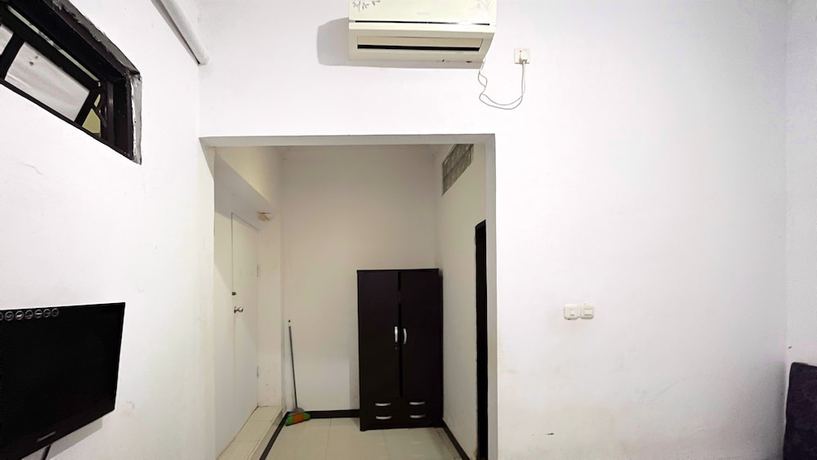 Imagen de la habitación del Hotel OYO 92100 Kost Biru. Foto 7