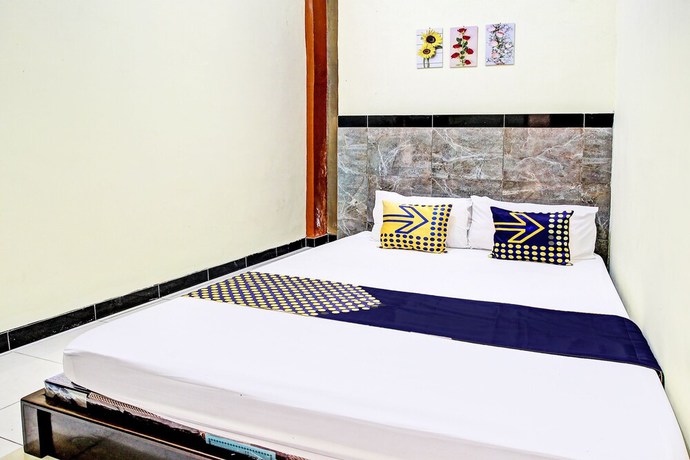 Imagen de la habitación del Hotel OYO 92123 Chikam House Syariah. Foto 7