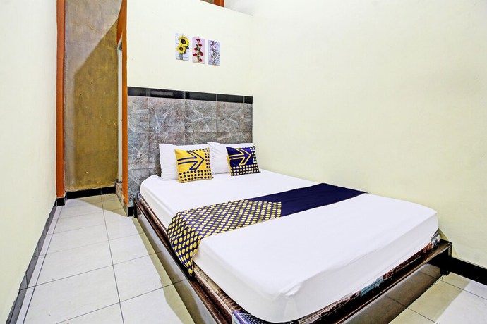 Imagen de la habitación del Hotel OYO 92123 Chikam House Syariah. Foto 8