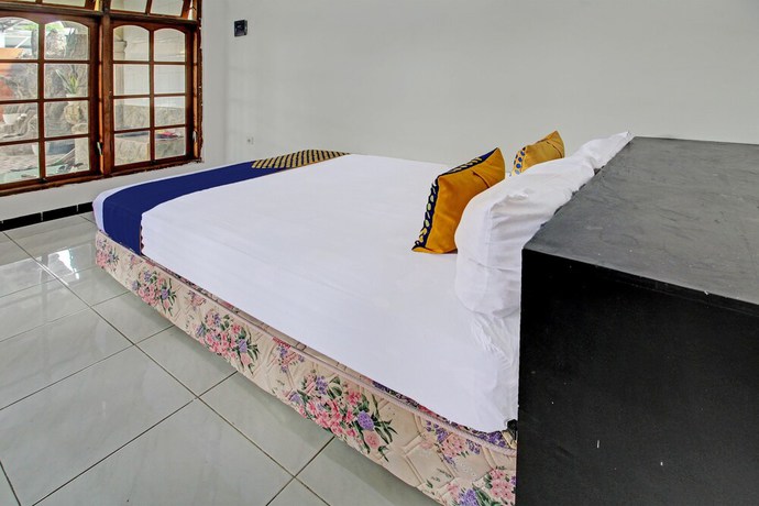 Imagen de la habitación del Hotel OYO 92123 Chikam House Syariah. Foto 11