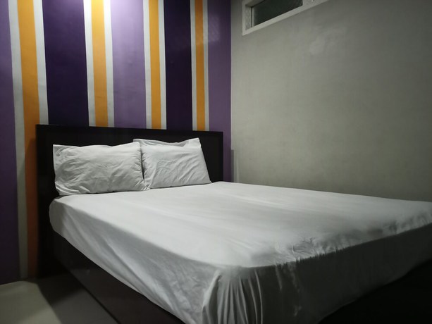 Imagen de la habitación del Hotel OYO 92126 Syariah Sumber Mulya Nunukan. Foto 4