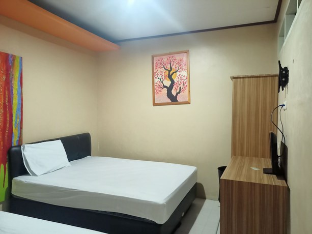 Imagen de la habitación del Hotel OYO 92126 Syariah Sumber Mulya Nunukan. Foto 7