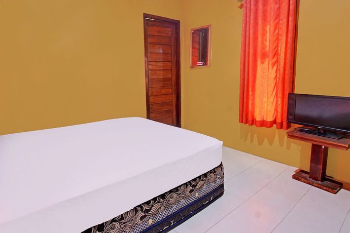 Imagen de la habitación del Hotel OYO 92142 Ujung Samalas Homestay. Foto 11