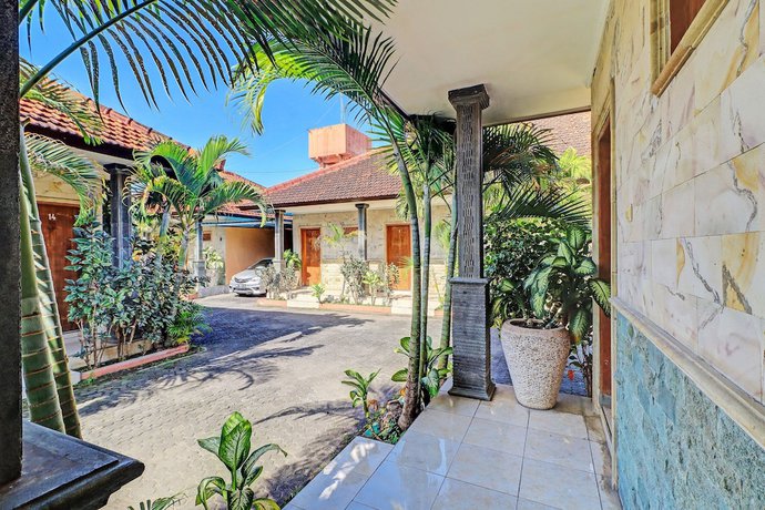Imagen de los interiores del Hotel OYO 92175 Surya Madu Guest House Near Pantai Kelan. Foto 9