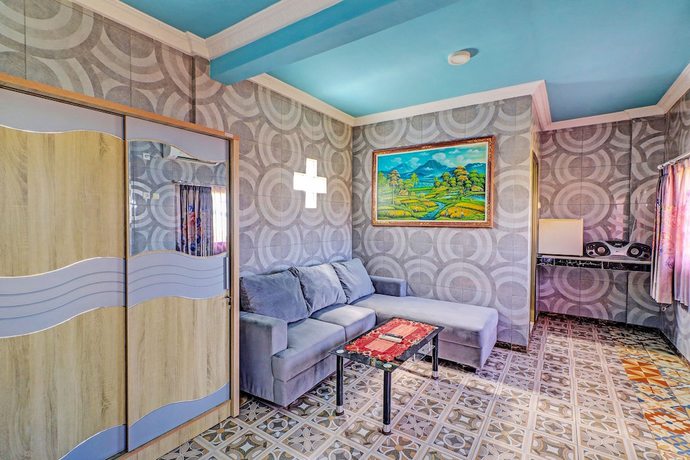 Imagen de la habitación del Hotel OYO 92175 Surya Madu Guest House Near Pantai Kelan. Foto 6