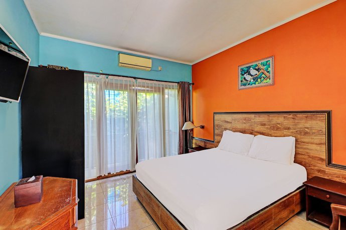 Imagen de la habitación del Hotel OYO 92175 Surya Madu Guest House Near Pantai Kelan. Foto 8