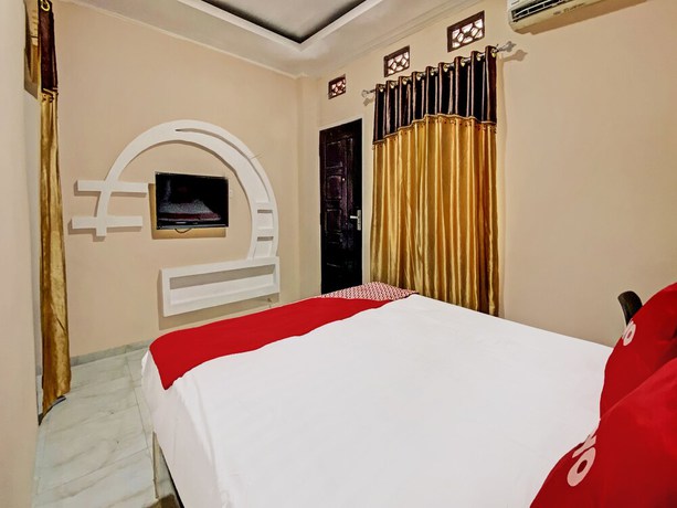 Imagen de la habitación del Hotel OYO 92193 Kos 21. Foto 8