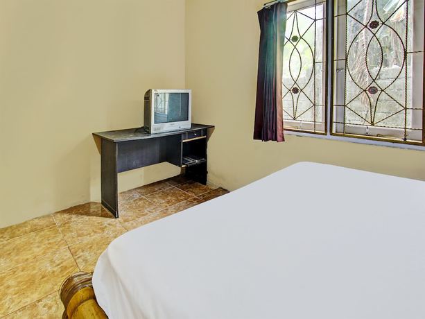 Imagen de la habitación del Hotel OYO 92197 Zahira Homestay. Foto 11