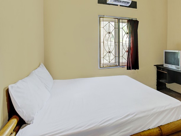 Imagen de la habitación del Hotel OYO 92197 Zahira Homestay. Foto 12