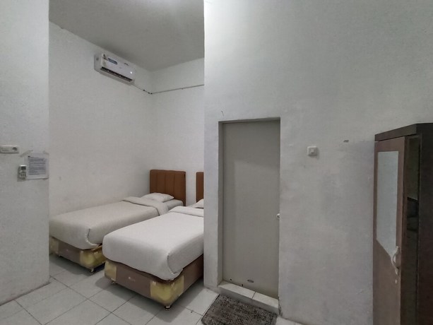 Imagen de la habitación del Hotel OYO 92207 Koperasi. Foto 1