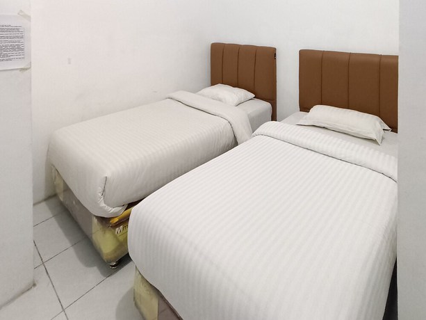 Imagen de la habitación del Hotel OYO 92207 Koperasi. Foto 2
