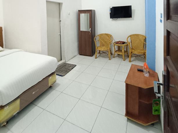 Imagen de la habitación del Hotel OYO 92207 Koperasi. Foto 3