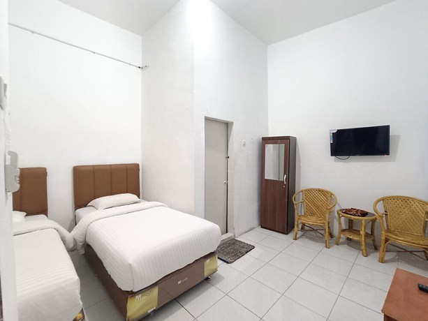 Imagen de la habitación del Hotel OYO 92207 Koperasi. Foto 5