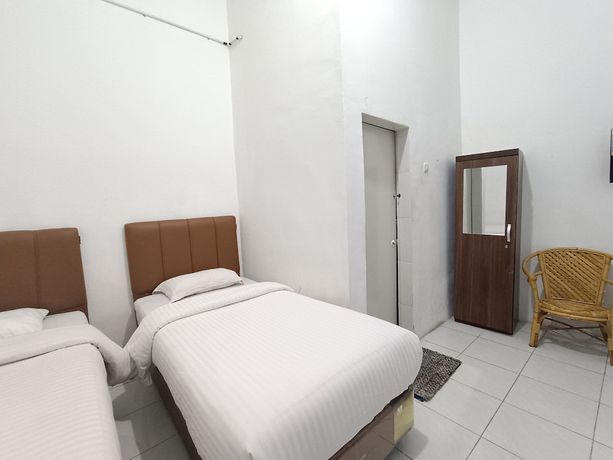 Imagen de la habitación del Hotel OYO 92207 Koperasi. Foto 9
