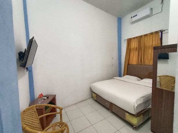 Imagen de la habitación del Hotel OYO 92207 Koperasi. Foto 10