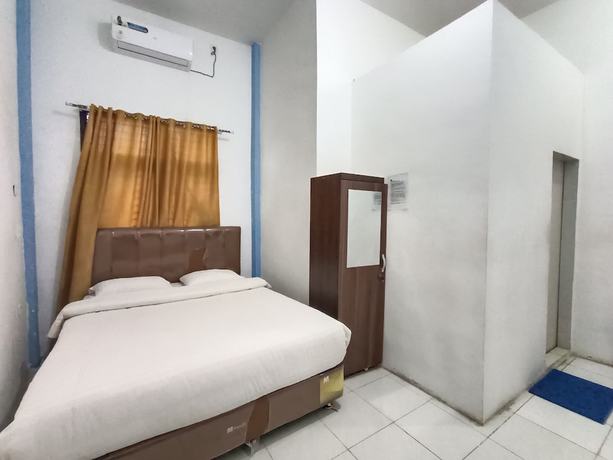 Imagen de la habitación del Hotel OYO 92207 Koperasi. Foto 12