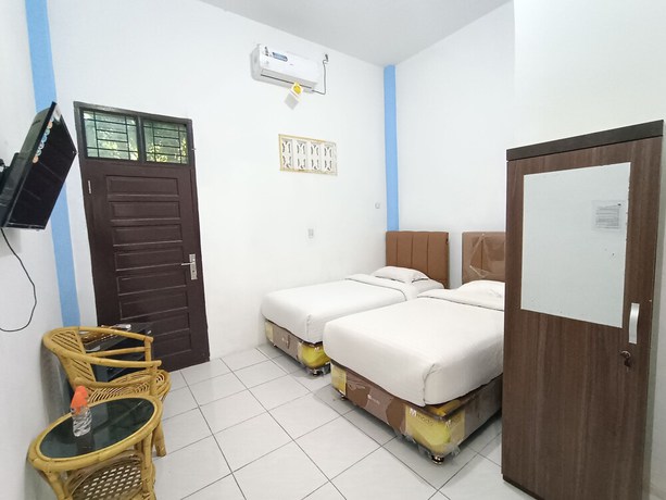 Imagen de la habitación del Hotel OYO 92207 Koperasi. Foto 13