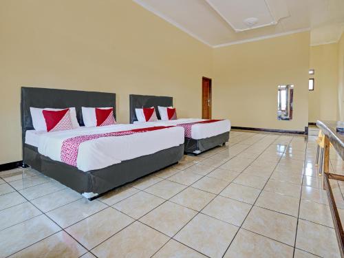 Imagen de la habitación del Hotel OYO 92217 Artana 2 Chipsari. Foto 20