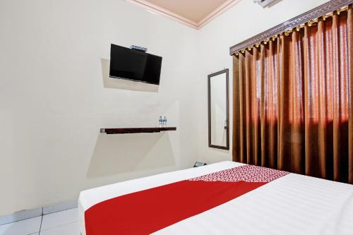 Imagen de la habitación del Hotel OYO 92289 Aji Kusuma. Foto 20