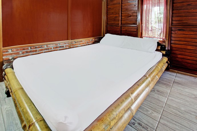 Imagen de la habitación del Hotel OYO 92354 Samalas Syariah Homestay. Foto 11