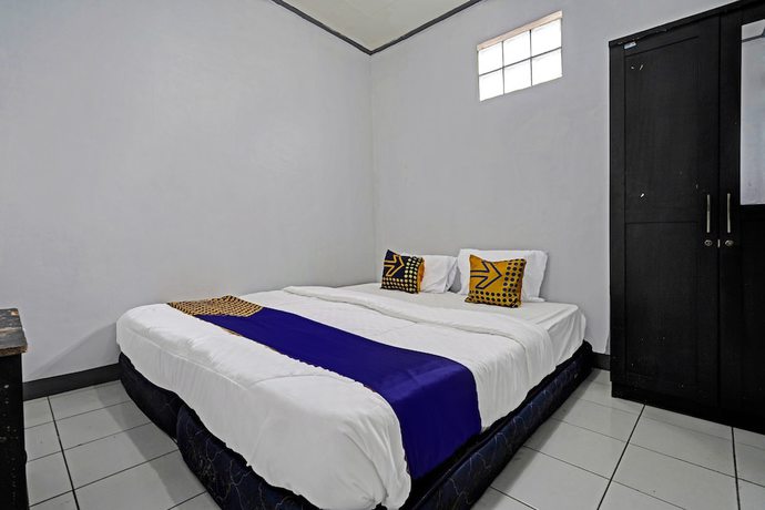 Imagen de la habitación del Hotel OYO 92512 Atlanta Guesthouse. Foto 3